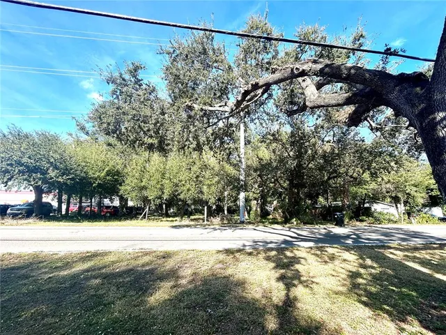 a view of a yard with a tree