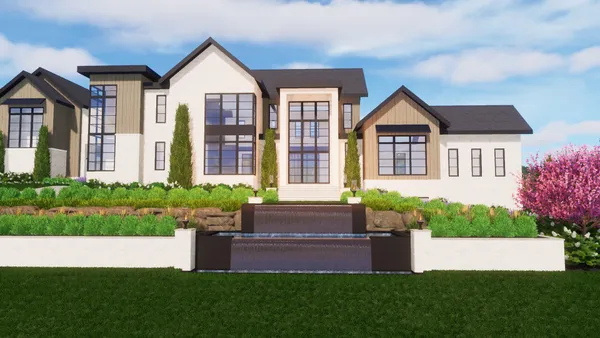 a front view of a house with a garden and plants