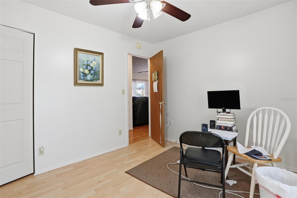 3280 Ambassador Avenue Spring Hill, FL 34609 - Photo 15 of 36 a room with furniture and a flat screen tv