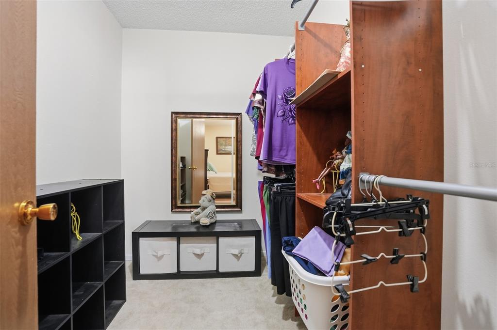 3280 Ambassador Avenue Spring Hill, FL 34609 - Photo 21 of 36 a bathroom with a sink vanity and mirror
