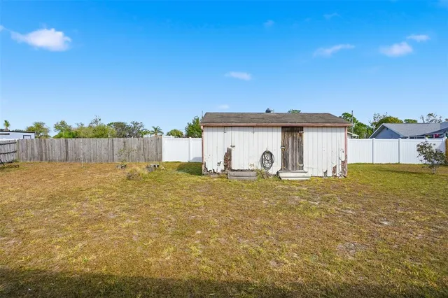 a house view with a backyard space