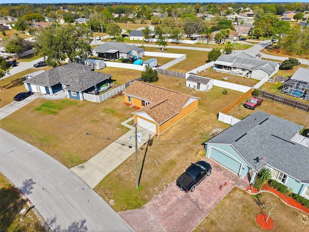 3280 Ambassador Avenue Spring Hill, FL 34609 - Photo 30 of 36 an aerial view of a swimming pool and outdoor space