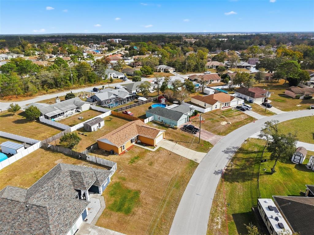 3280 Ambassador Avenue Spring Hill, FL 34609 - Photo 32 of 36 an aerial view of residential houses with outdoor space