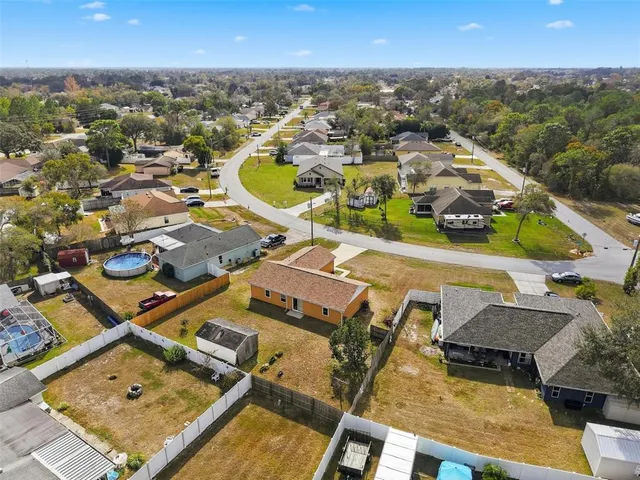 an aerial view of a house with swimming pool