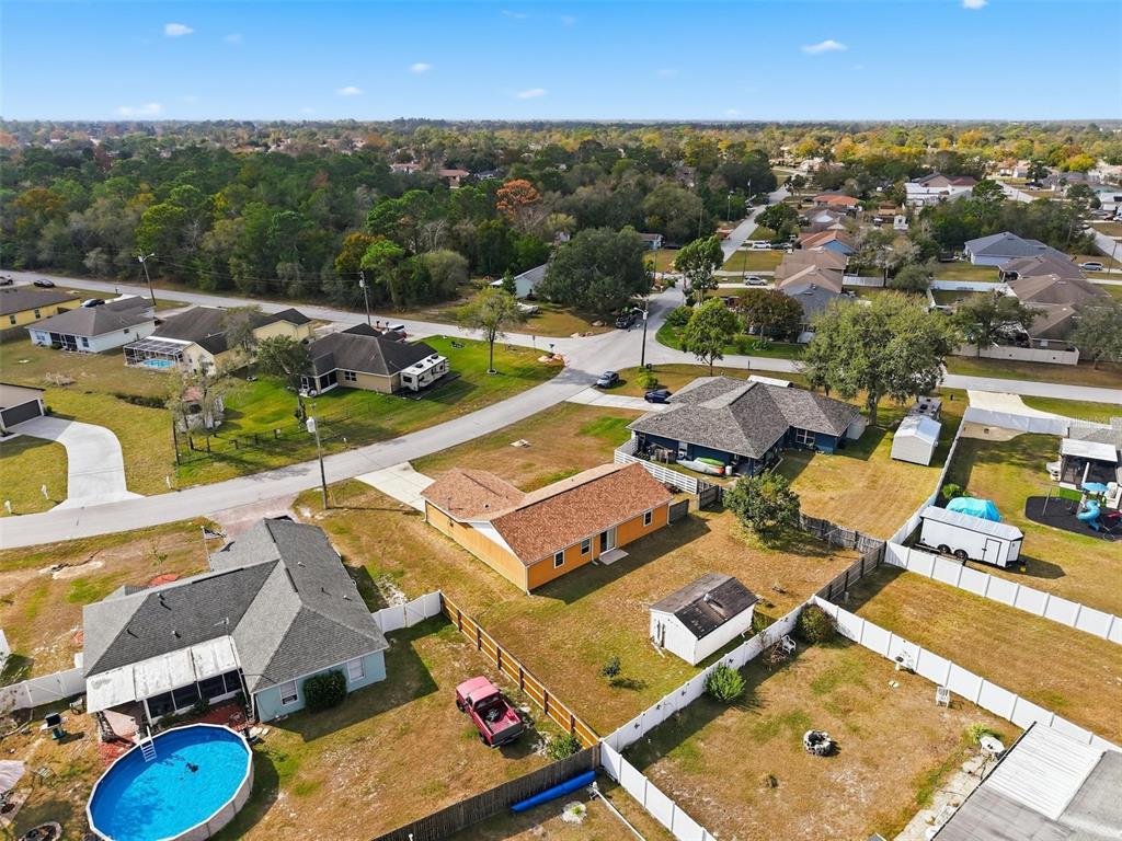 3280 Ambassador Avenue Spring Hill, FL 34609 - Photo 35 of 36 an aerial view of a house with swimming pool