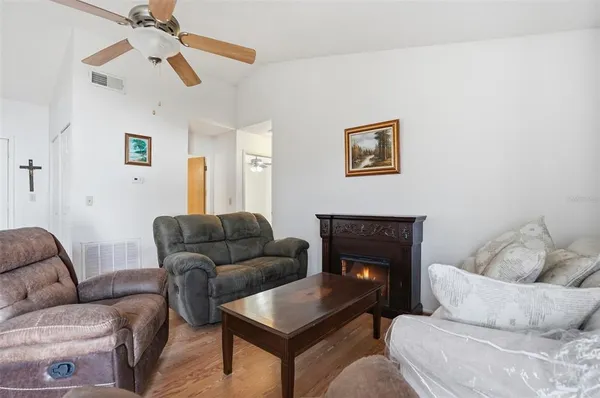 a kitchen with a refrigerator and a stove top oven
