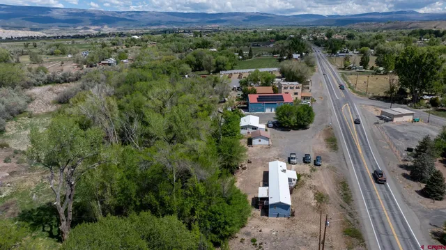 an aerial view of a city and mountain view in back