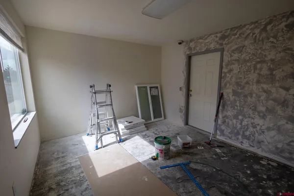 a room with furniture and a window