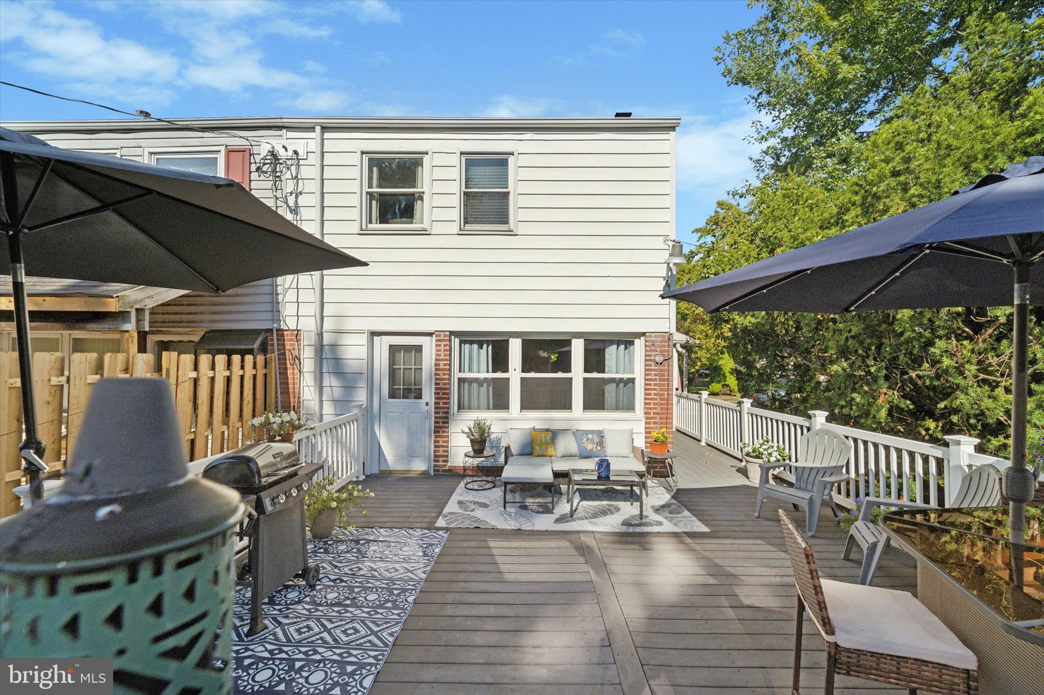 720 Swarthmorewood Lane Swarthmore, PA 19081 - Photo 21 of 25 a view of a house with backyard sitting area and garden