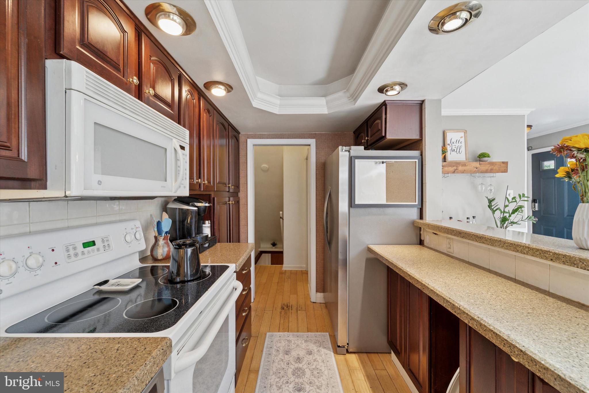 720 Swarthmorewood Lane Swarthmore, PA 19081 - Photo 7 of 25 a kitchen that has a sink and a stove