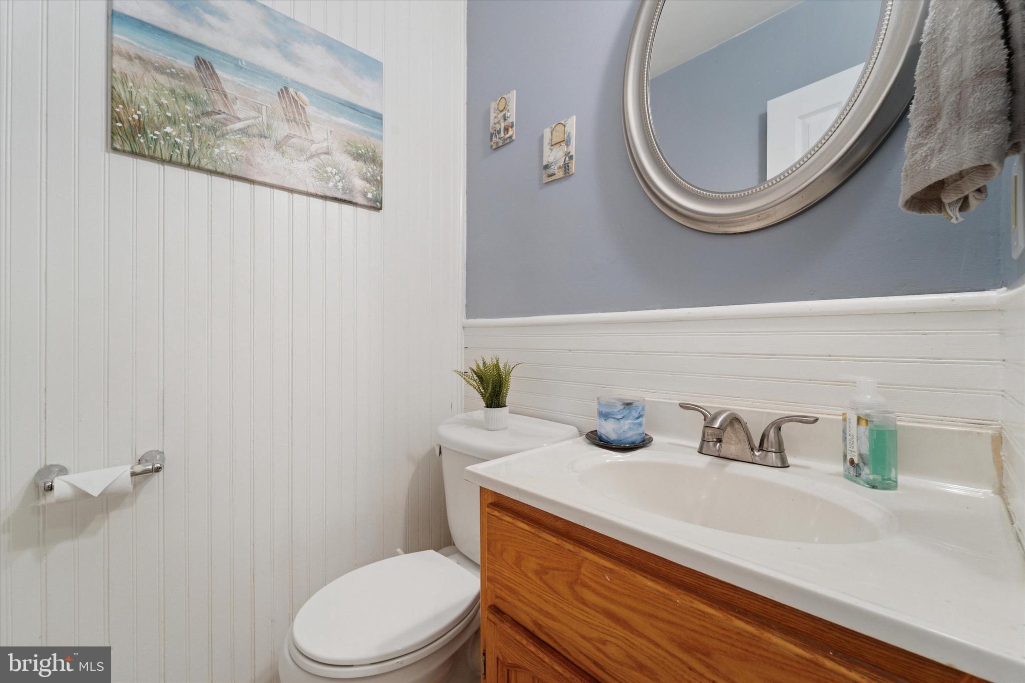 720 Swarthmorewood Lane Swarthmore, PA 19081 - Photo 9 of 25 a bathroom with a sink a toilet and a mirror