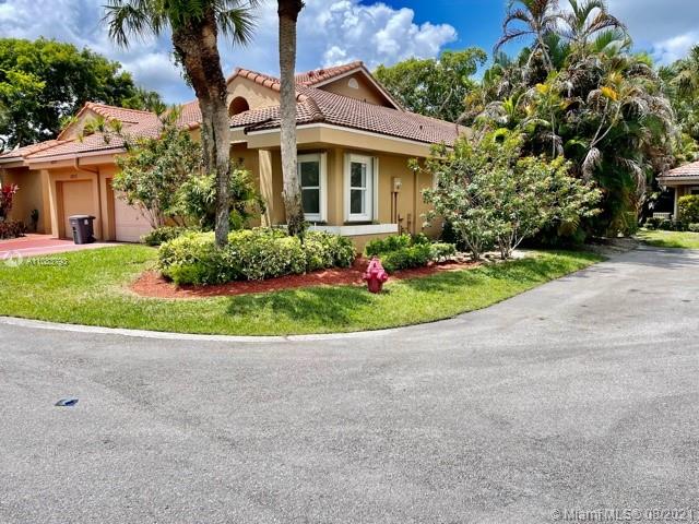 11069 Rios Road, Unit 11069 Boca Raton, FL 33498 - Photo 1 of 14 front view of a house with a yard