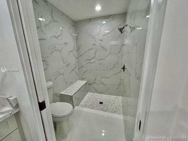 11069 Rios Road, Unit 11069 Boca Raton, FL 33498 - Photo 11 of 14 a bathroom with a toilet and shower