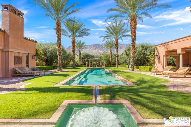 a front view of house with a garden