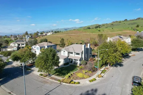 an aerial view of a house with a lake view