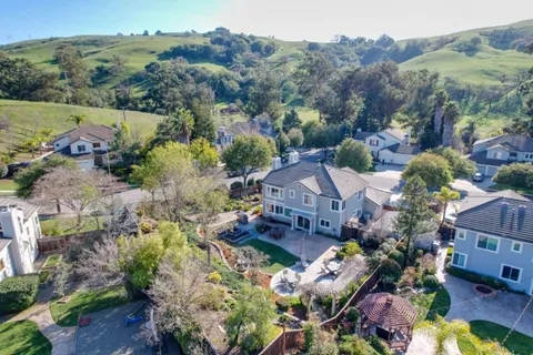 an aerial view of a house with a garden