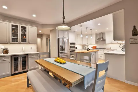 a kitchen with a sink appliances and cabinets