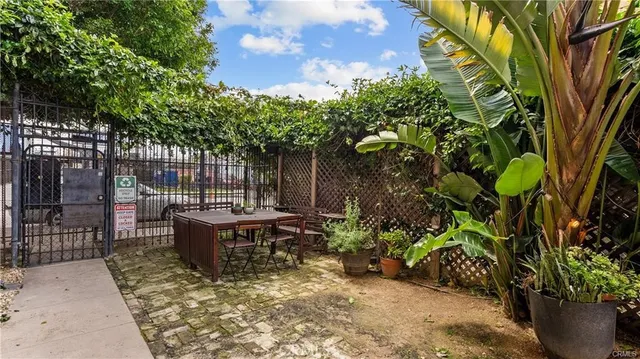 a view of a backyard with sitting area