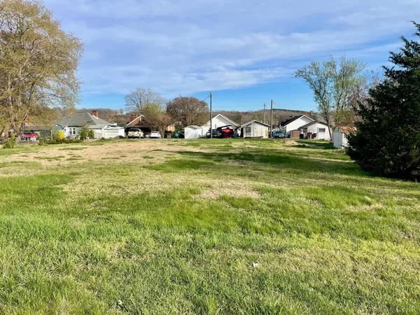 a view of a garden with houses