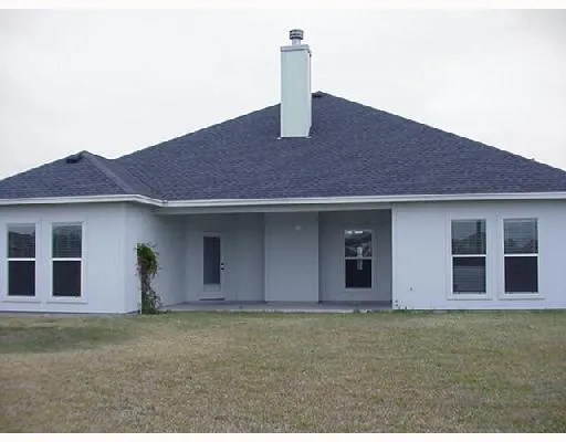 a front view of a house with yard