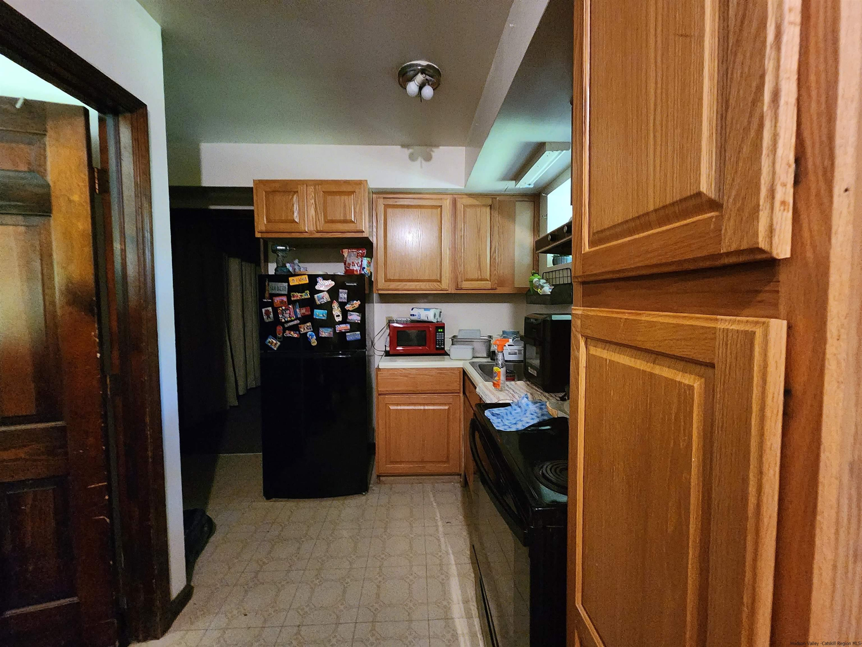 49 Old Post Road Poughkeepsie, NY 12601 - Photo 15 of 19 a kitchen with a refrigerator and washer