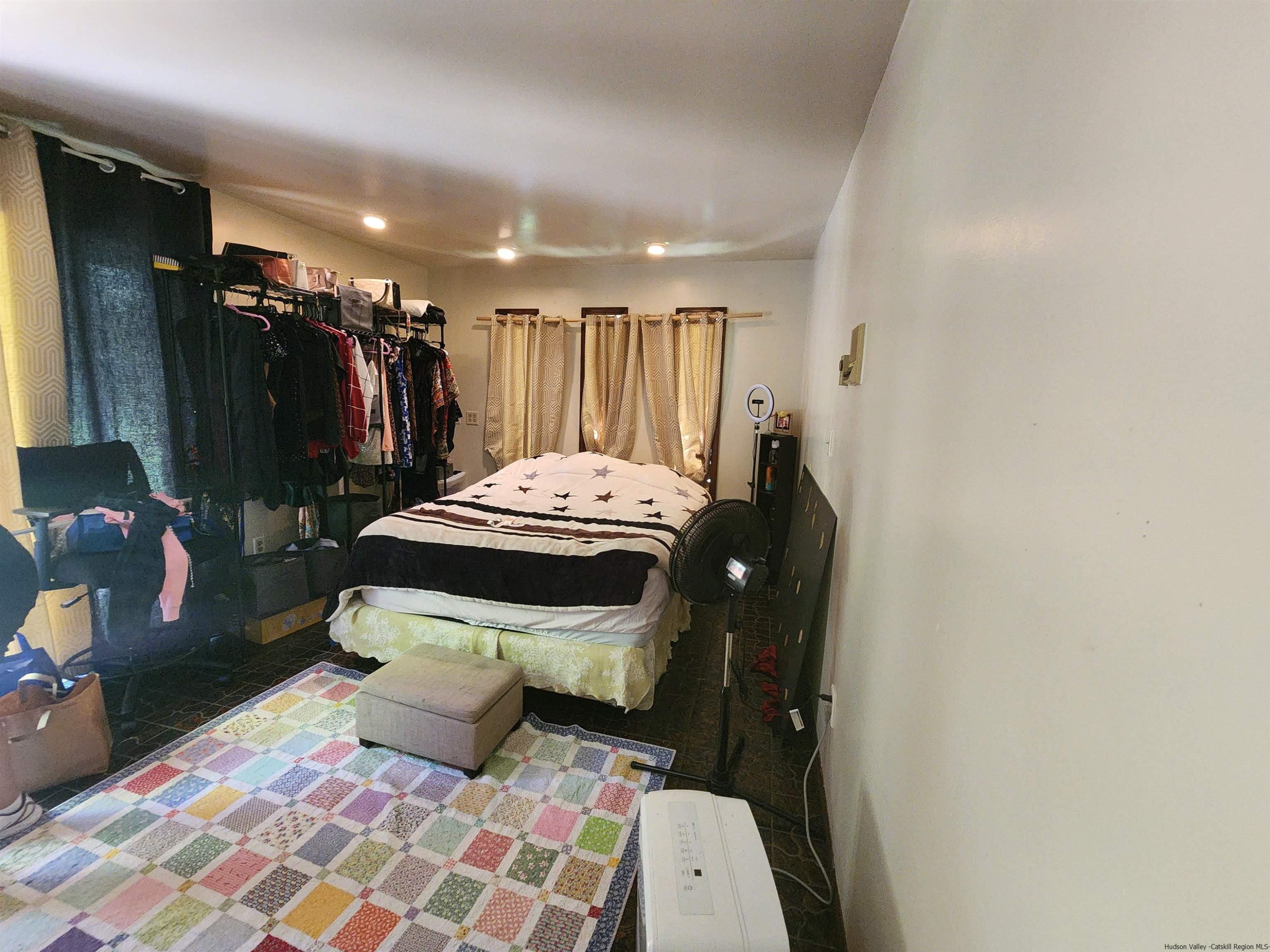 49 Old Post Road Poughkeepsie, NY 12601 - Photo 9 of 19 a bedroom with a bed and a walk in closet