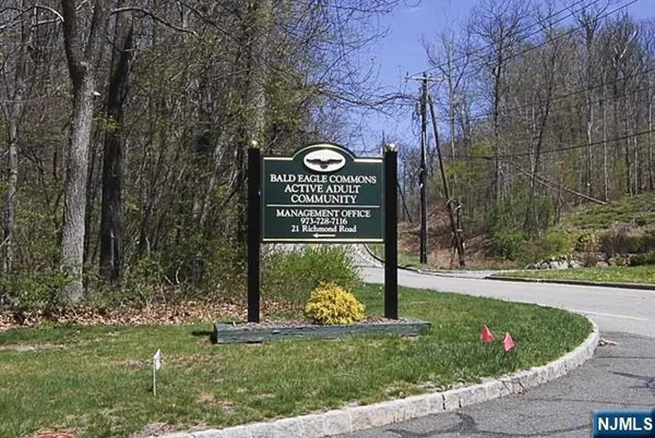 a view of a park with iron fence