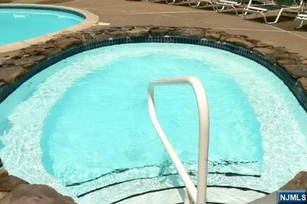 a view of a swimming pool with a yard