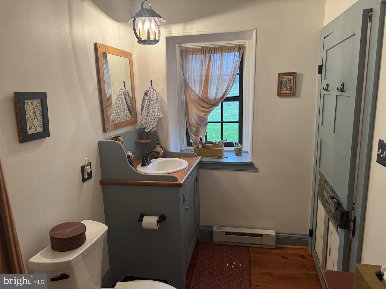 262 Orrtanna Road Orrtanna, PA 17353 - Photo 27 of 43 a bathroom with a sink a toilet and a mirror