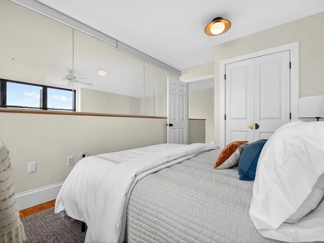 a bed room with a bed and a window