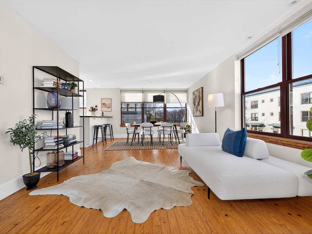 62-76 Cornwall Street, Unit 74 (E) Boston, MA 02130 - Photo 5 of 34 a bedroom with furniture and a wooden floor