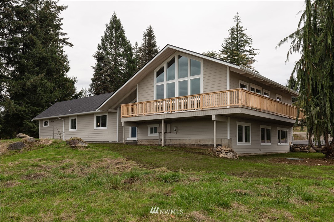 33114 Sultan Basin Road Sultan, WA 98294 - Photo 1 of 30 a front view of a house with yard and green space