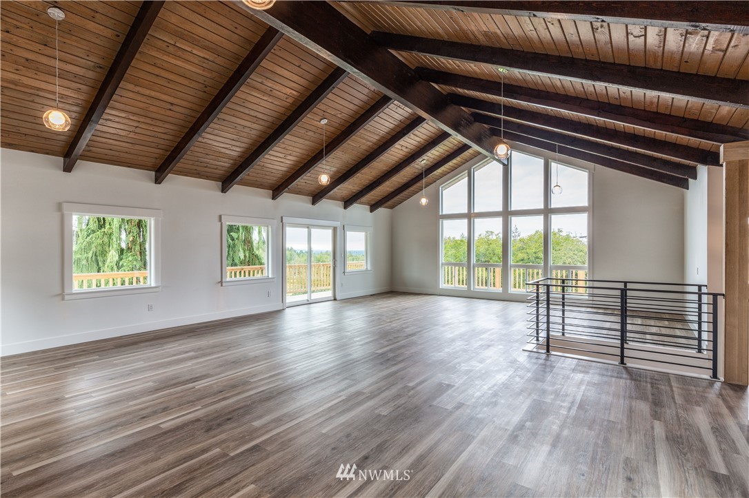 33114 Sultan Basin Road Sultan, WA 98294 - Photo 14 of 30 a view of empty room with wooden floor and fan