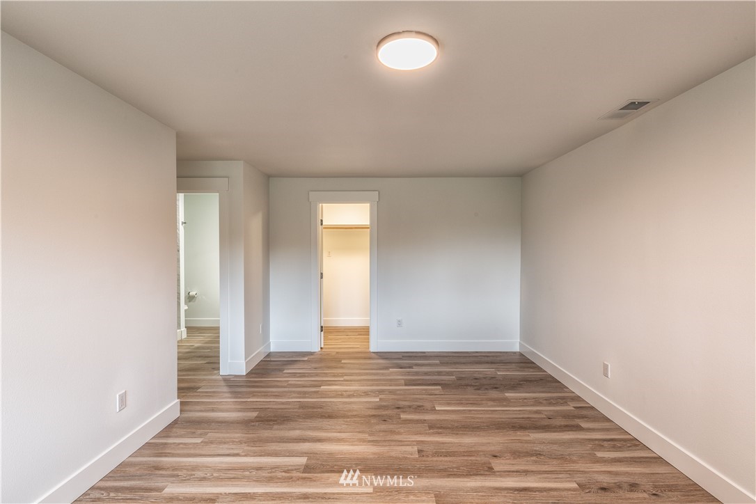 33114 Sultan Basin Road Sultan, WA 98294 - Photo 16 of 30 an empty room with wooden floor and windows