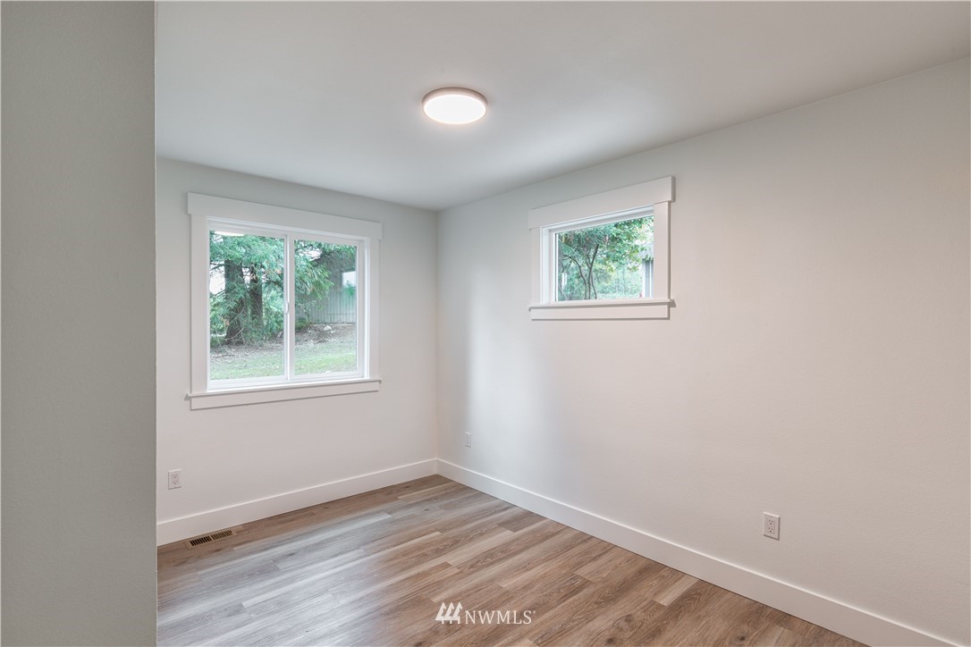 33114 Sultan Basin Road Sultan, WA 98294 - Photo 19 of 30 an empty room with wooden floor and window