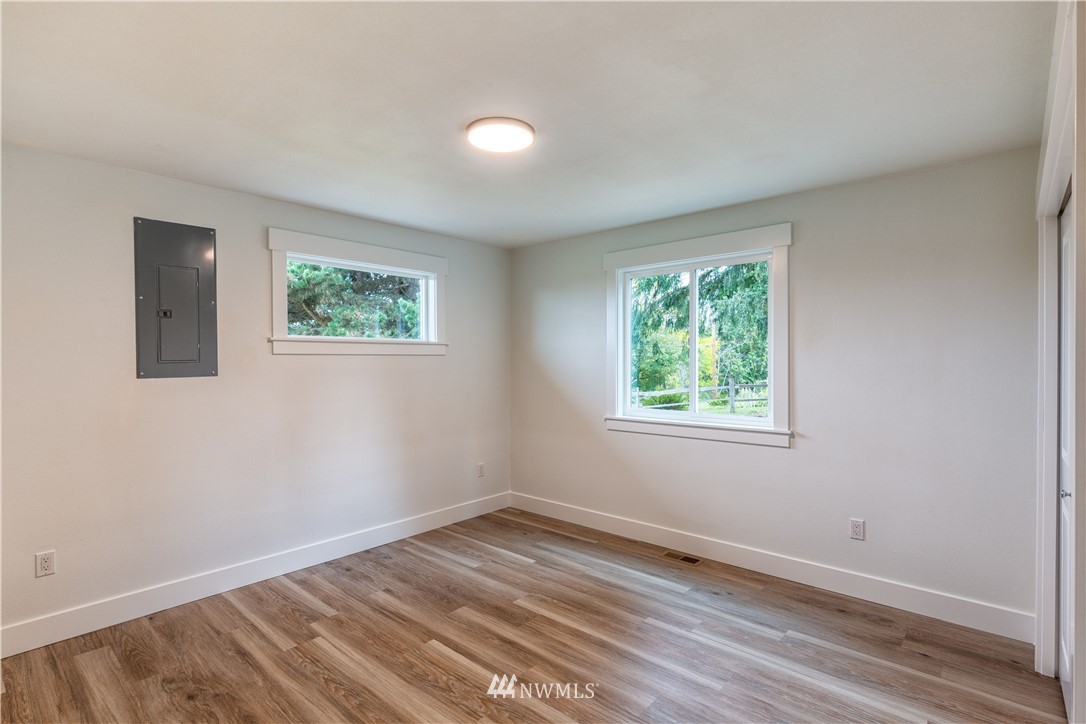 33114 Sultan Basin Road Sultan, WA 98294 - Photo 22 of 30 wooden floor in an empty room with a window