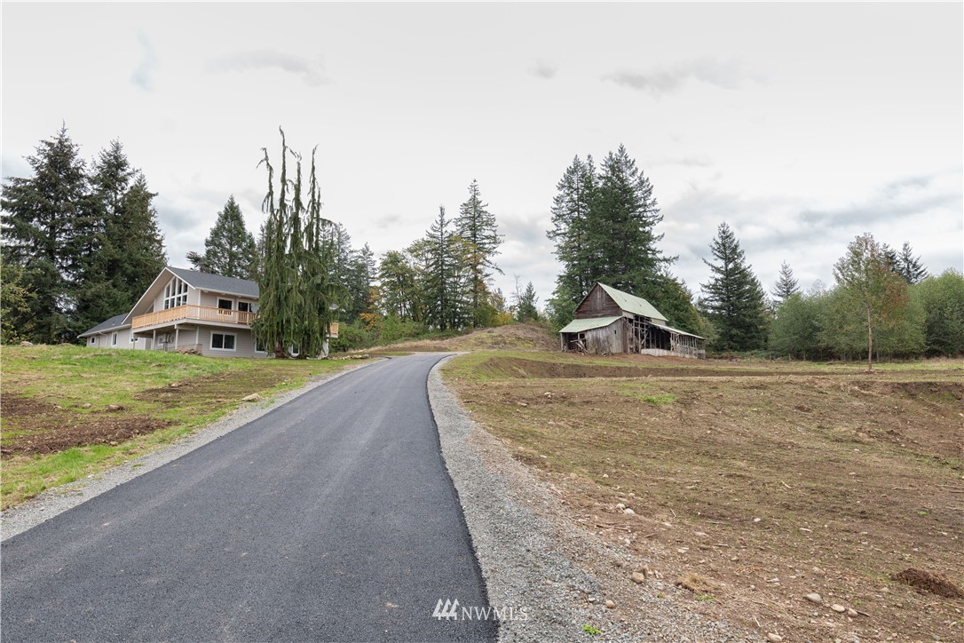 33114 Sultan Basin Road Sultan, WA 98294 - Photo 28 of 30 a view of a house with a yard