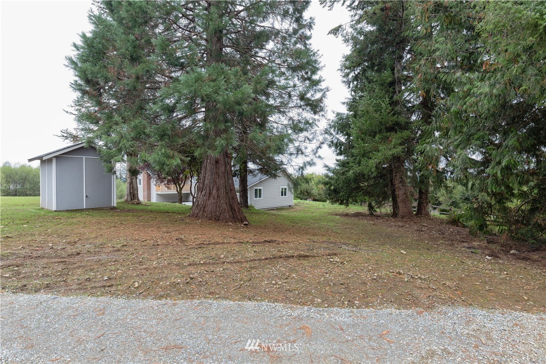 33114 Sultan Basin Road Sultan, WA 98294 - Photo 29 of 30 a house with trees in front of it