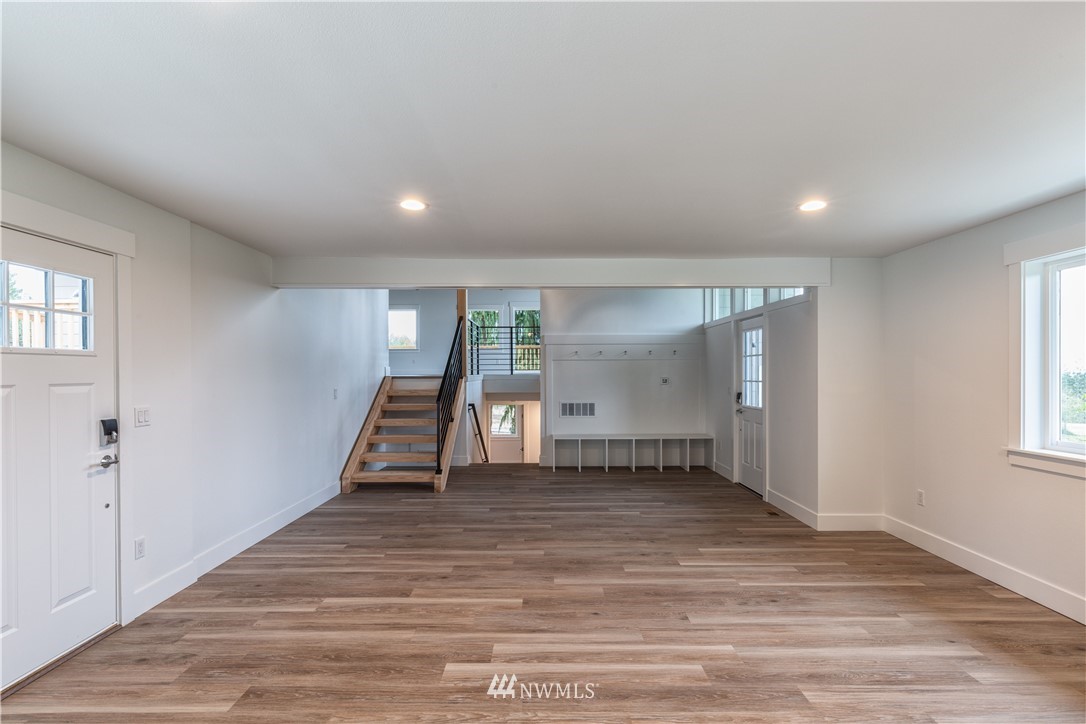 33114 Sultan Basin Road Sultan, WA 98294 - Photo 9 of 30 wooden floor in an empty room with a window