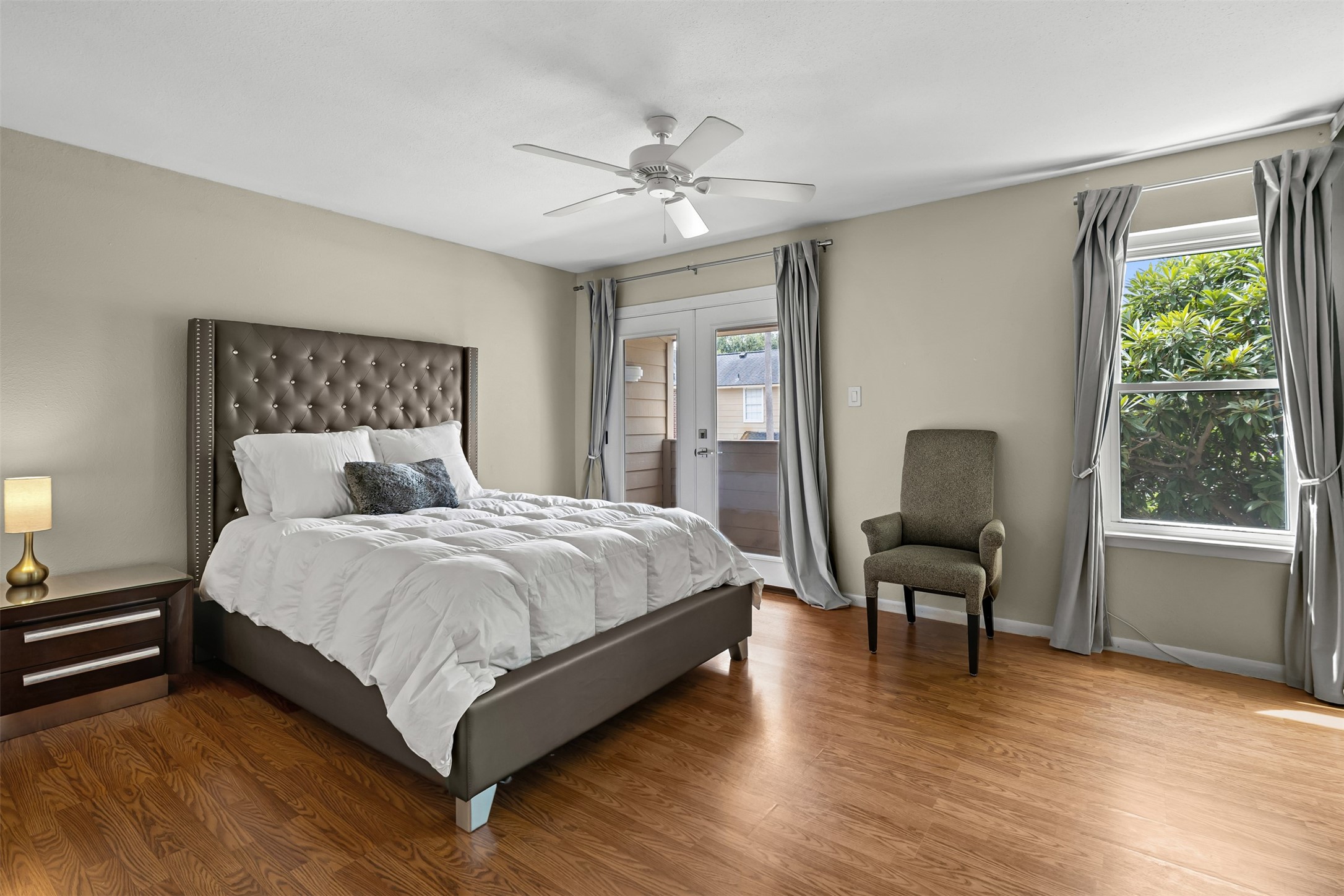 1500 Sandy Springs Road, Unit 22 Houston, TX 77042 - Photo 15 of 31 This beautiful primary bedroom is situated at the back of the house, offering enhanced privacy.