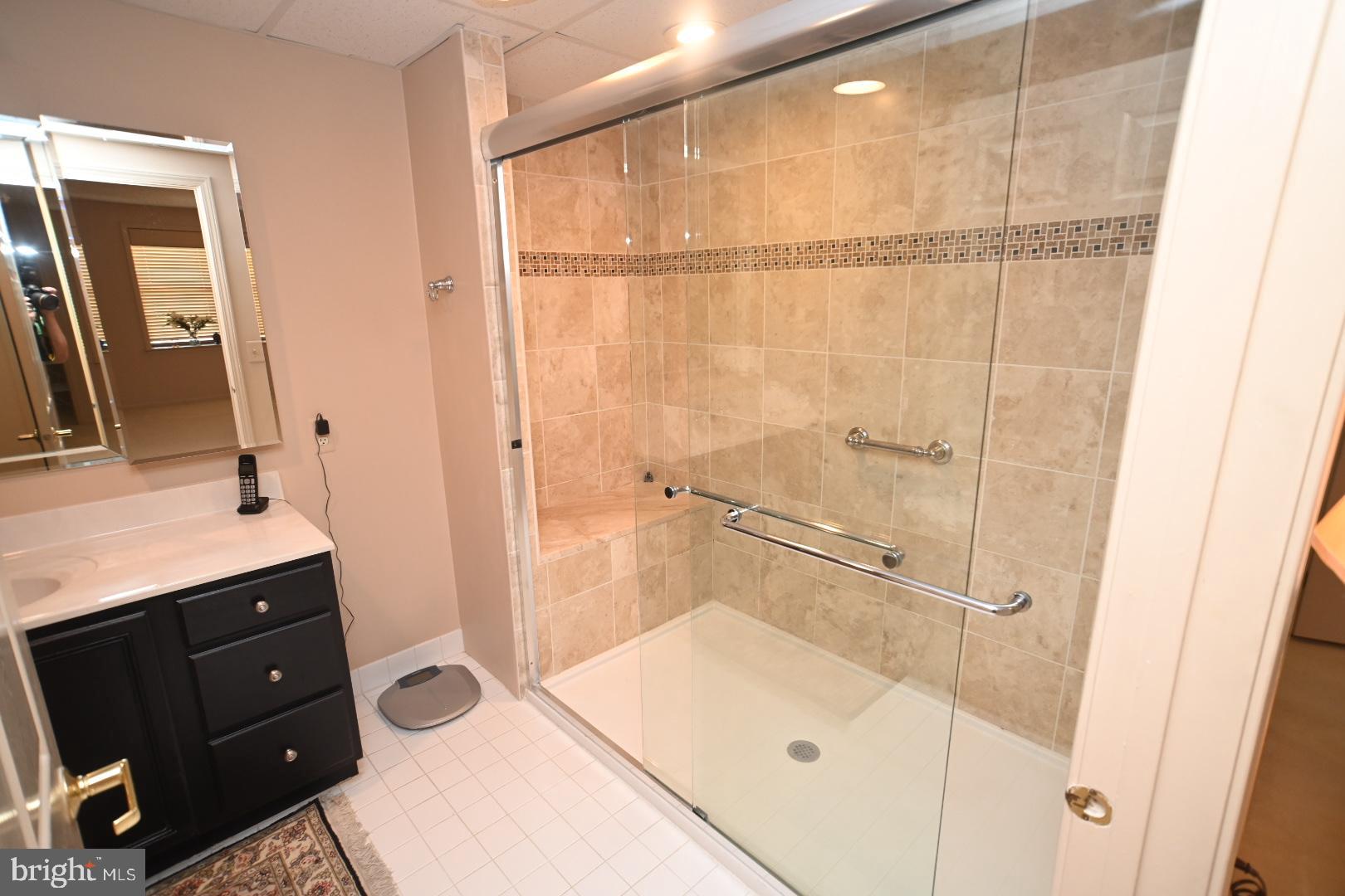 3409 Centennial Station Warminster, PA 18974 - Photo 24 of 76 a bathroom with a granite countertop sink mirror and shower