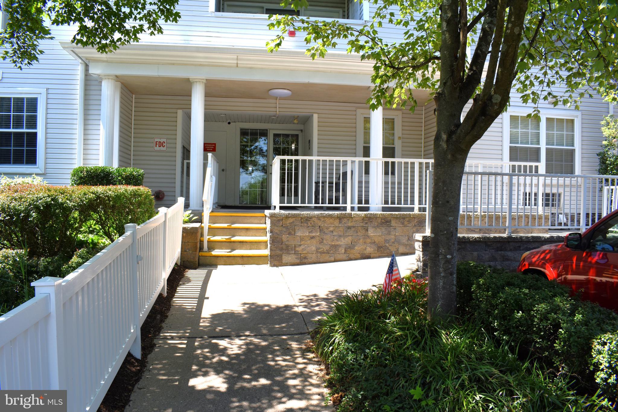 3409 Centennial Station Warminster, PA 18974 - Photo 3 of 76 a view of a house with a small yard and a large tree