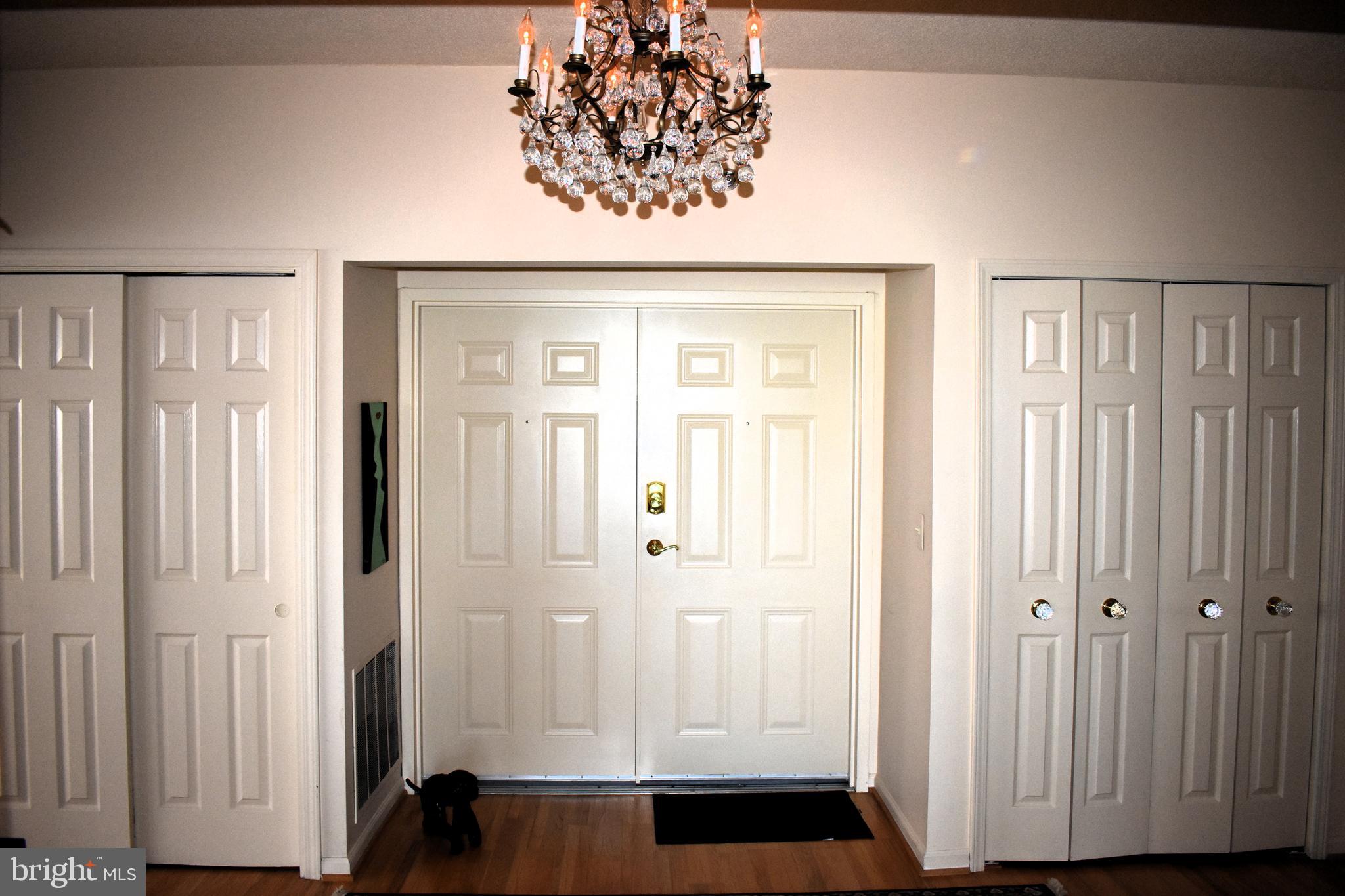 3409 Centennial Station Warminster, PA 18974 - Photo 6 of 76 a view of a hallway with wooden floor and staircase