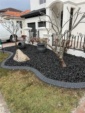 a view of a house with a snow in the yard