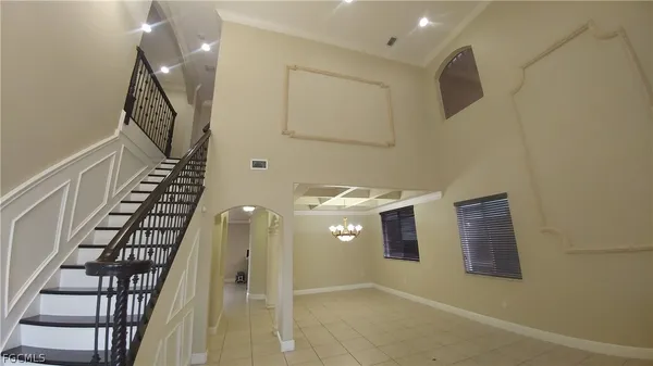 a view of entryway and hall with a front door
