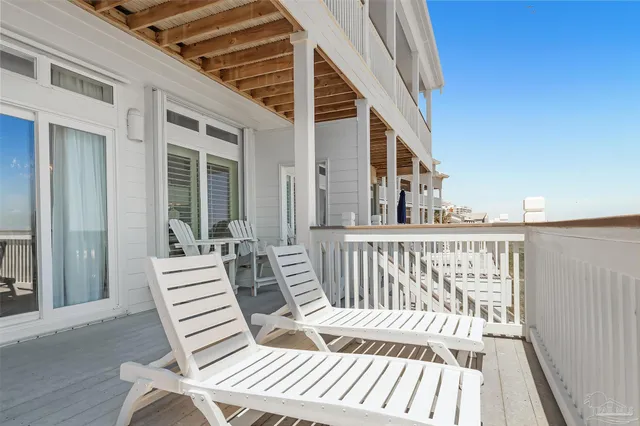a view of outdoor space with deck and furniture