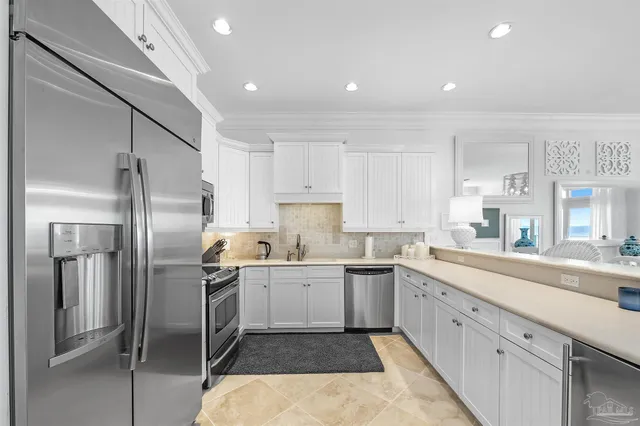 a kitchen with a sink stainless steel appliances and cabinets