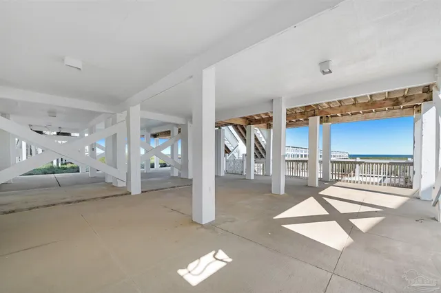 a view of a livingroom with a dinning table and chairs