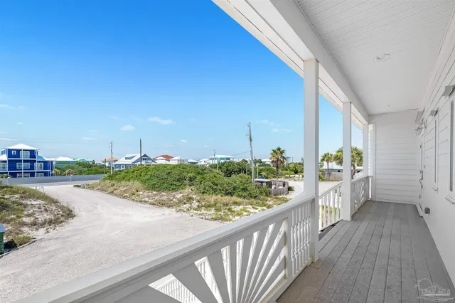 a view of a floor to ceiling window and potted plants
