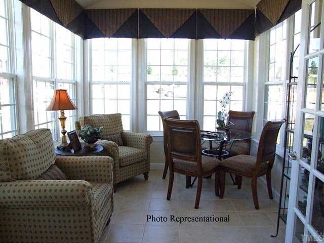 4713 Split Branch Court Raleigh, NC 27604 - Photo 8 of 12 a living room with furniture and a large window